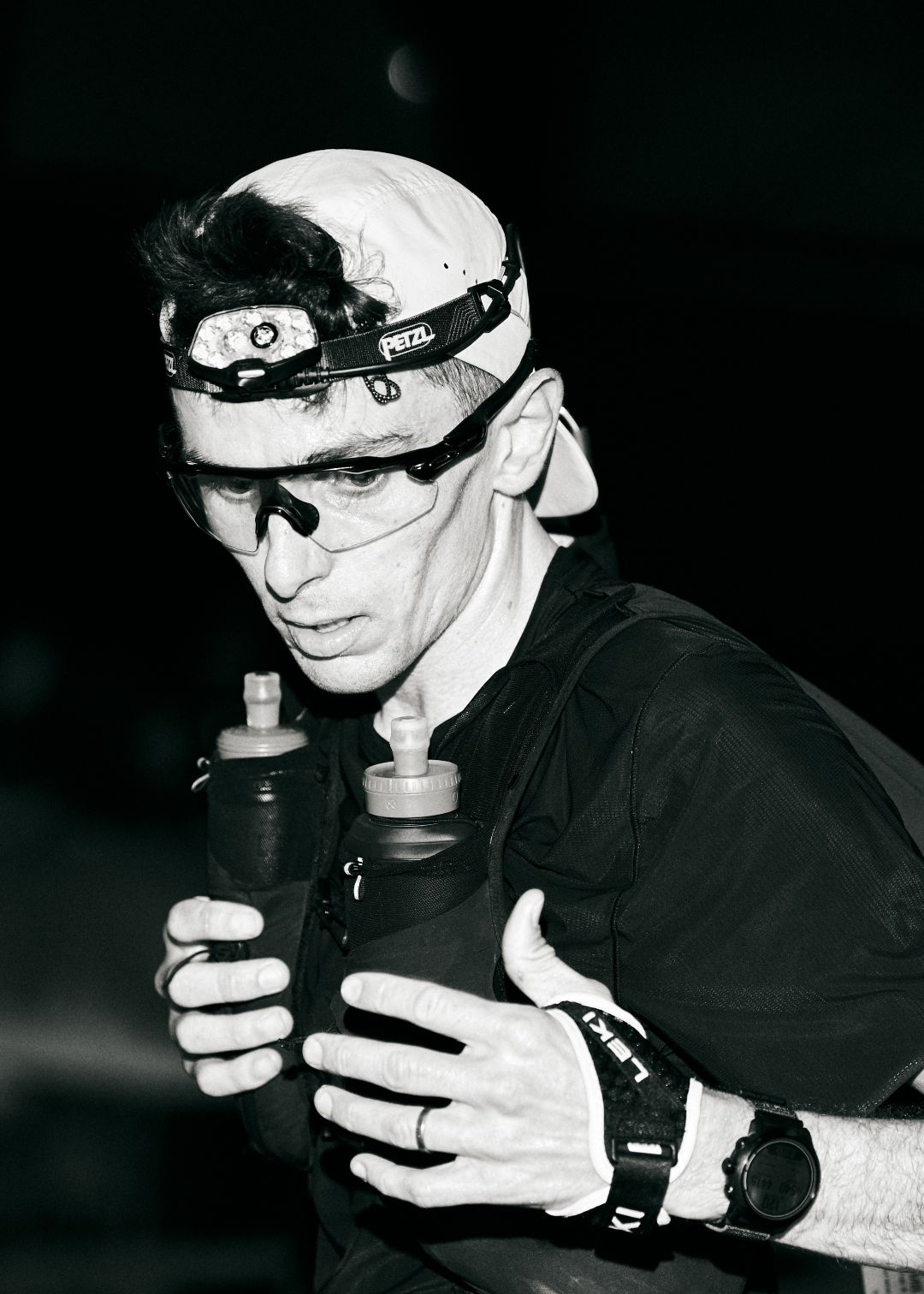 Runner carrying two water bottles